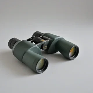 pair of binoculars, on a plain white background, even lighting