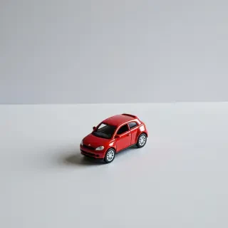 A small red toy car