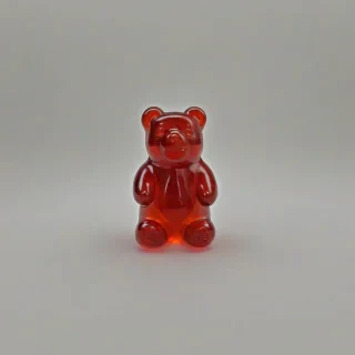 single, large gummy bear, wide angle shot, only one gummy bear in image, on a plain white background, even lighting