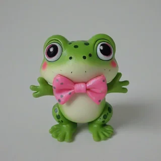 chibi style frog with a pink bow, on a plain white background, even lighting