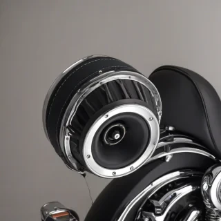 A detailed, full-body view of a Harley Davidson rear speaker pod, made of black leather and chrome, with a wide shot and feet visible, on a plain white background, in a photography style with dynamic shadows and backlight