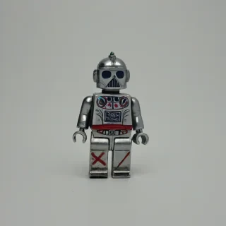 toy metal jack, on a plain white background, even lighting