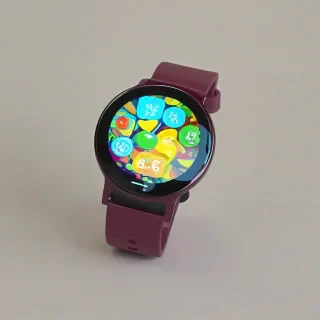 A maroon, pop art style, wearable gadget, such as a smartwatch or fitness tracker, with a bold and colorful design, on a plain white background, in a full-body view, with the device's screen and buttons clearly visible, and a fun, playful atmosphere, with bright colors and abstract shapes, in the style of a graphic illustration, with a wide-angle shot, and a sense of dynamic energy