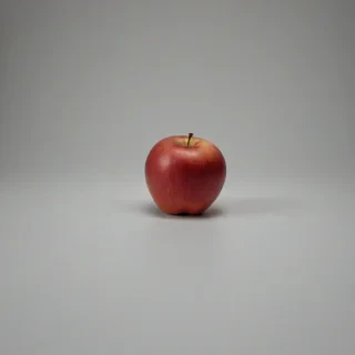 A colorful, whole, red apple, full-body view, on a plain white background, on a plain white background, even lighting 