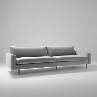 A sleek, modern, gray, low-profile, velvet sofa, with clean lines and minimalist legs, in a wide shot, on a plain white background, with soft, natural light, and subtle shadows, in the style of modernist furniture design, on a plain white background, even lighting 