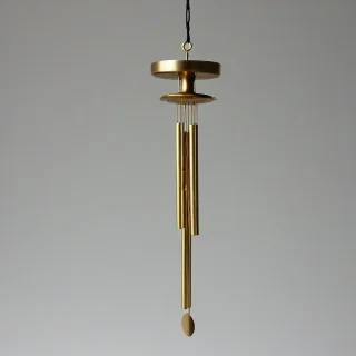 brass vortex windchime, on a plain white background, even lighting