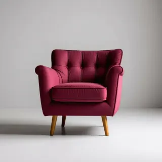 A wide shot of a brutalist-style maroon armchair with a sturdy, geometric base, tufted backrest, and a cushioned pink seat, with a light wood base, set against a plain white background, with dramatic shadows and a sense of industrial chic, in the style of a digital illustration