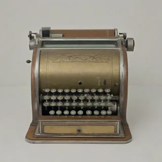 antique 1930's cash register, on a plain white background, even lighting
