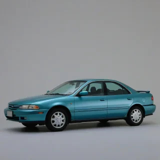 a blue greenish 1995 mazda 626 hatchback sedan, on a plain white background, even lighting