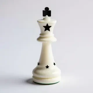 queen chess piece white with black stars