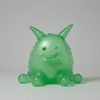 jiggly, green, transparent blob monster, on a plain white background, even lighting
