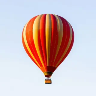 red and gold striped hot air balloon
