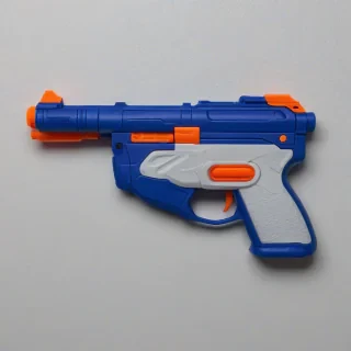 blue plastic nerf gun, on a plain white background, even lighting