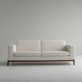 A sleek, modern sofa with clean lines and minimal ornamentation, set against a plain white background, in a wide shot with the entire piece of furniture visible, with a focus on the texture of the upholstery and the subtle play of light on its surface, in the style of contemporary furniture design, on a plain white background, even lighting 