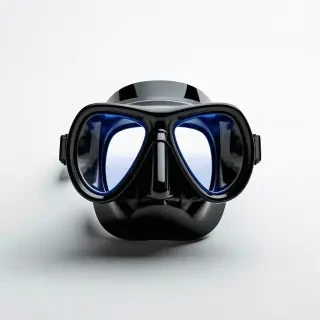 A black scuba mask with blue tinted plastic