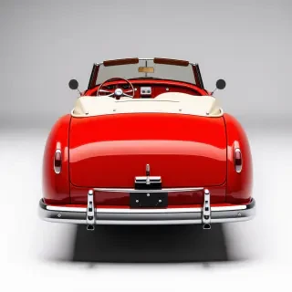 A full-body view of a red and white antique convertible car, with a sleek, curved design and chrome accents, parked on a plain white background, with white wall tires, with a warm, sunny lighting and a slight sheen to the car's surface, in the style of a classic 1950s American automobile, with vibrant red and white colors and a sense of nostalgia, wide shot with the car's wheels and floor visible