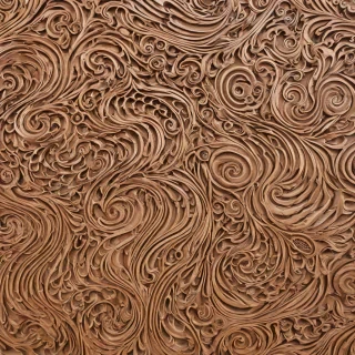 2" thick, 8' by 4' rectangular wooden wall panel with intricate wave-like carvings, natural grain, and warm brown tones, on a plain white background