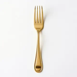 A golden fork with three tines
