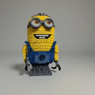 Minion made out of lego bricks, on a plain white background, even lighting 