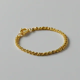 gold bracelet, on a plain white background, even lighting